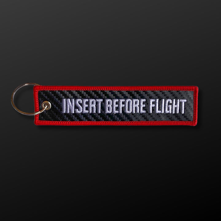 Etiqueta clave estilo fibra de carbono "Insertar antes del vuelo"