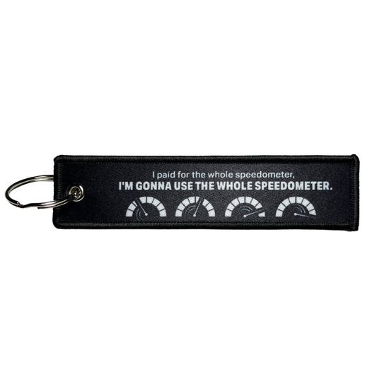 Keychain that says, "I paid for the whole speedometer, I'm gonna use the whole speedometer." textile for cars, trucks, motorcycles, and more vehicles